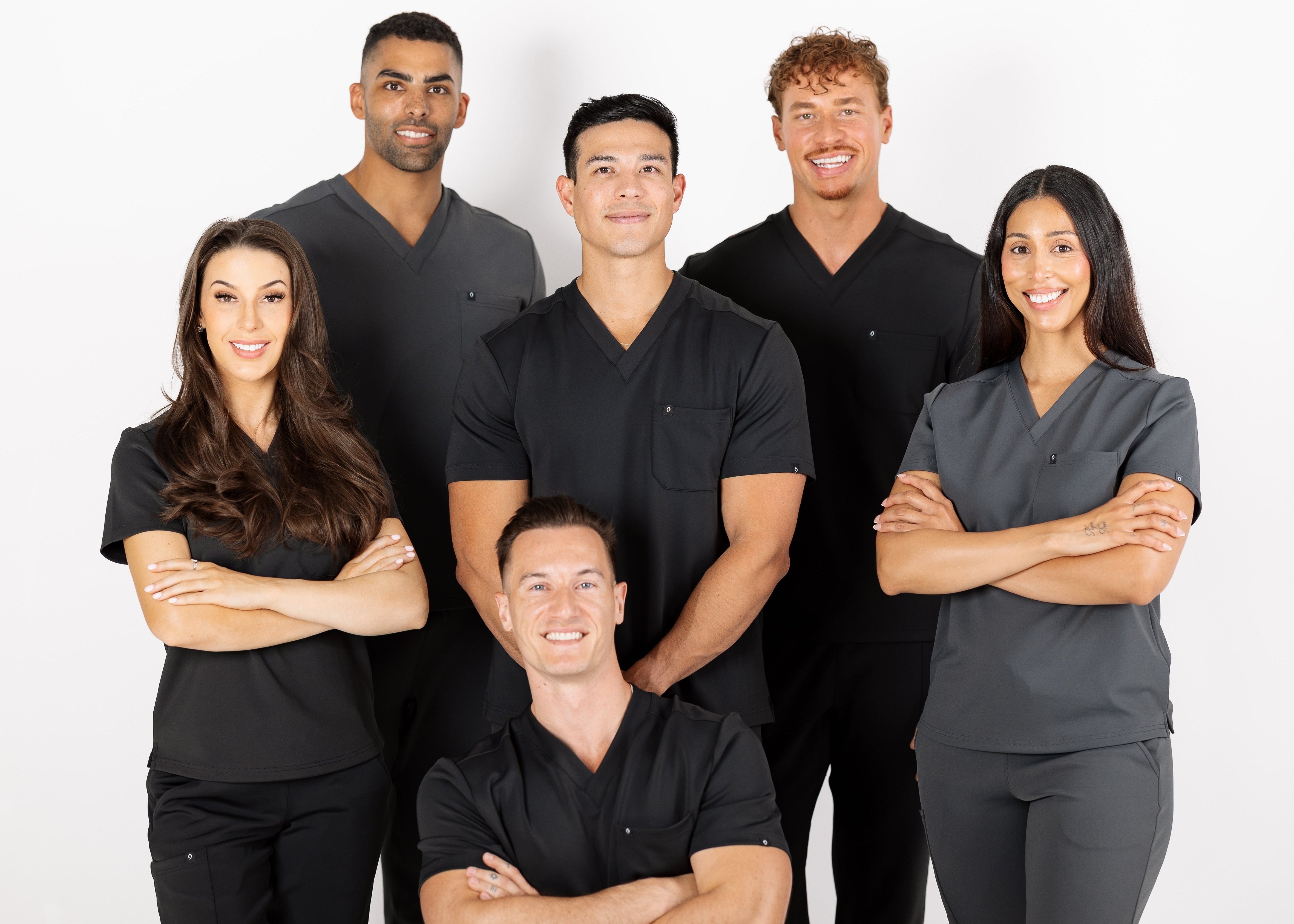 SAYS scrubs group photo in black and Gray with founder Dr. Evan Schrader